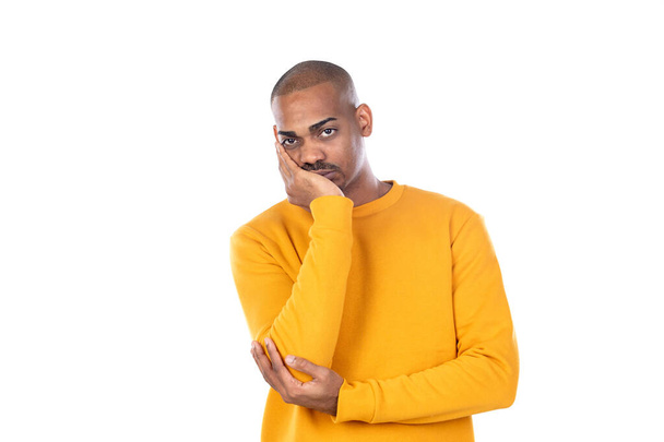 Afroamerican guy wearing a yellow jersey isolated on a white background - Zdjęcie, obraz