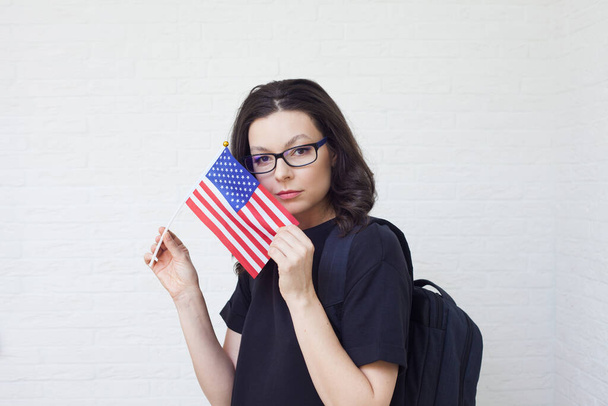 young woman with the flag of the United States of America. - Valokuva, kuva