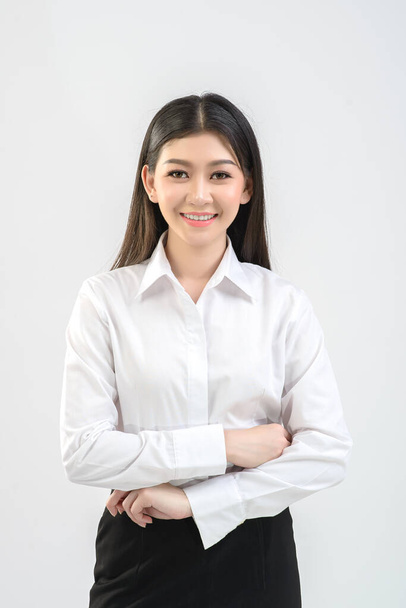 Office girl, online merchant is offering products on white background. Business, online trading, presenter concept. - Photo, Image
