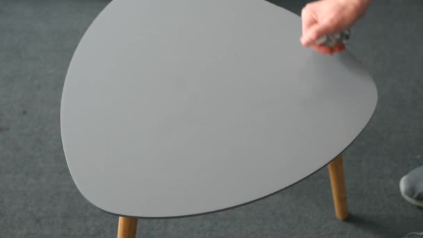 man with sanitizer cleaning coffee table - Footage, Video