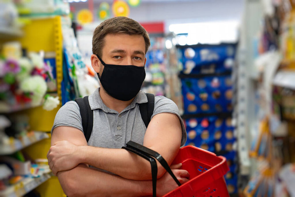 man Buyer wearing a protective mask. - Photo, Image