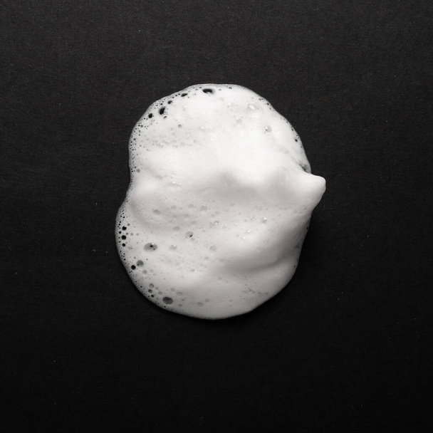 Soap foam isolated on black. - Φωτογραφία, εικόνα