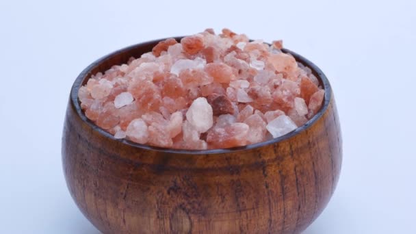 Close-up of wooden bowl with light pink Himalayan crystal salt. - Footage, Video