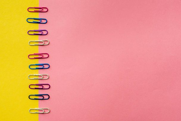 Colorful stationary office equipment or study guide. There are notebooks, scissors, pencils, paper clips of different sizes on a colored background to help or make the recording more organized. Photo from above. Place for inscription - Φωτογραφία, εικόνα