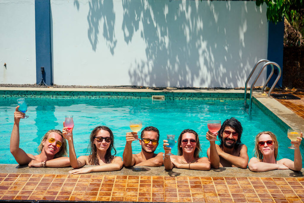 aquamarine color swimmingpool friends chillout in hot summer - Фото, изображение