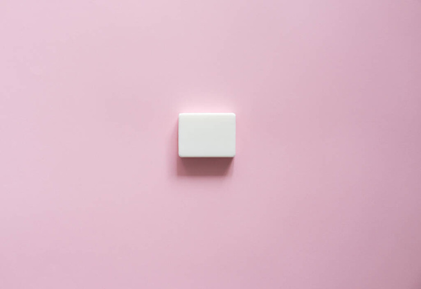 White soap on a pink background. Hand hygiene. Washing hands is a best way to prevent coronavirus Covid-19 while global pandemic. - Фото, изображение