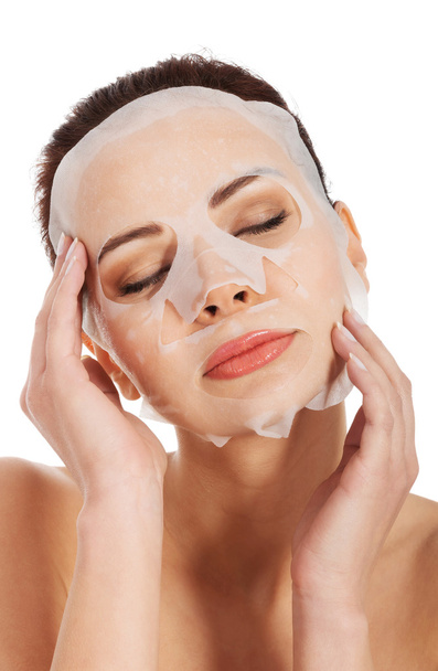 Beautiful woman with collagen mask. - Photo, image