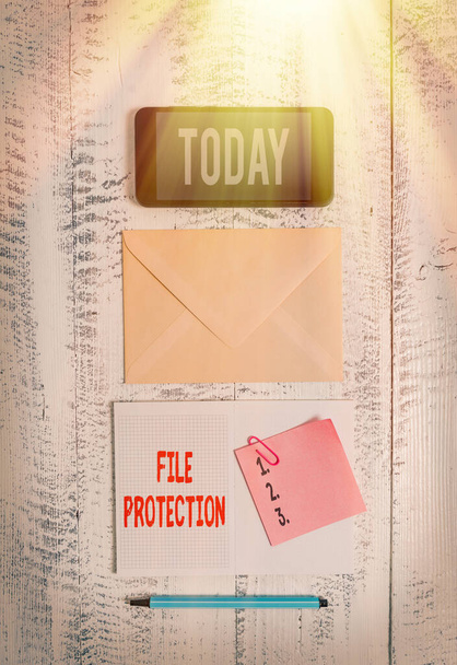 Word writing text File Protection. Business concept for Preventing accidental erasing of data using storage medium Envelop smartphone notepad note clip marker old wooden vintage background. - Photo, Image