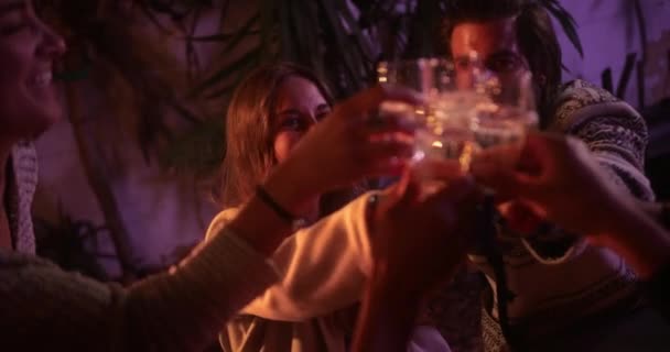 Close up caucasian couple toasting champagne with friends on patio - Materiał filmowy, wideo