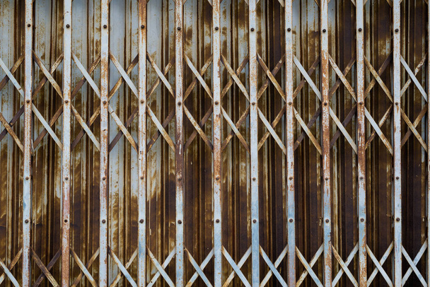 Rusty steel collapsible door texture, old fashion style shutter gate - Valokuva, kuva