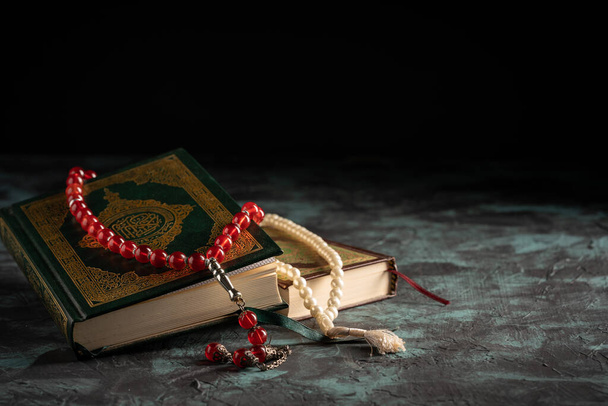 Islamic concept: The holy Quran and Tasbih (rosary beads) on dar - Photo, Image