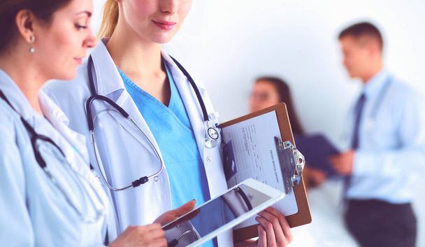 Young woman doctor holding a tablet pc - Foto, Bild