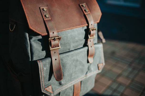 A closeup shot of a grey and brown rucksack - Zdjęcie, obraz