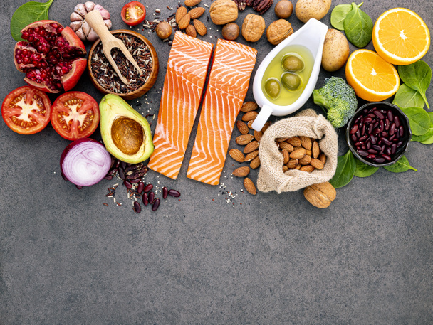 Ingredients for the healthy foods selection on dark background. Balanced healthy ingredients of unsaturated fats and fiber for the heart and blood vessels. - 写真・画像