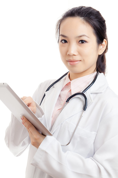 Asian young female doctor using tablet - Photo, image