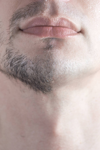 Vertical shot of man shaving concept. A close-up of a man's half-shaven chin. - Foto, immagini