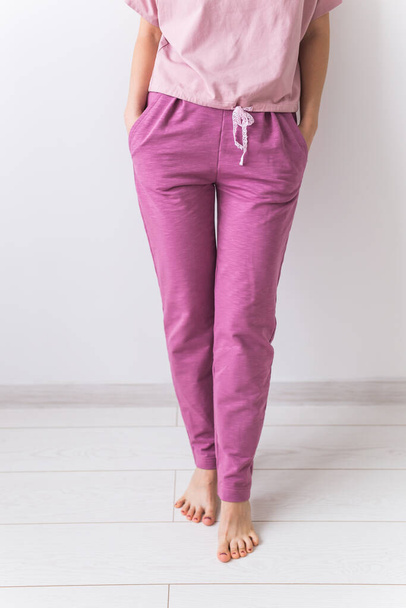 Warm pink kit for sleeping. Soft cotton t-shirt and pants. Comfortable clothes for healthy sleep. Pajamas concept. - Photo, Image