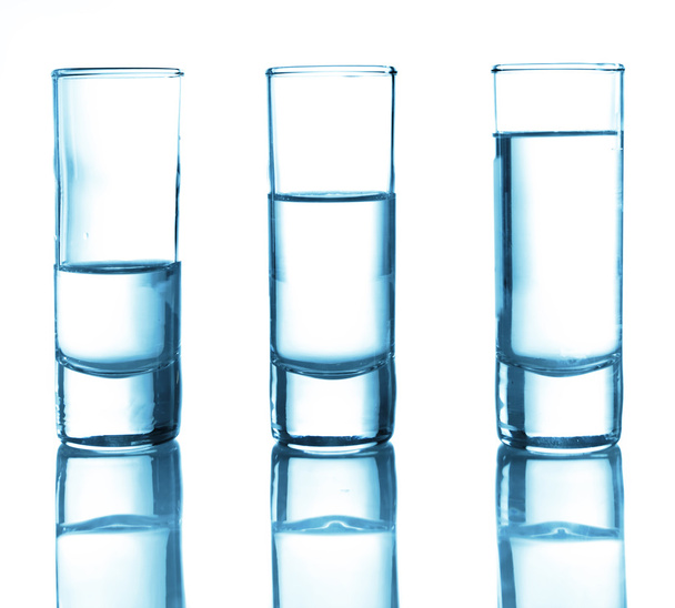 A row of glasses for vodka - Фото, изображение