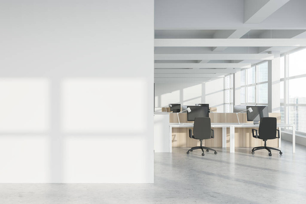 Interior of modern Industrial style open space office with white walls, concrete floor, rows of computer tables and panoramic windows with blurry cityscape. Mock up wall. 3d rendering - Fotoğraf, Görsel