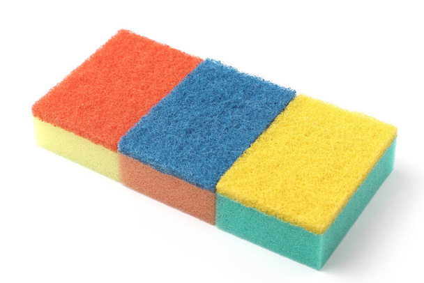 Bright colored kitchen sponges, close-up, white background. - 写真・画像