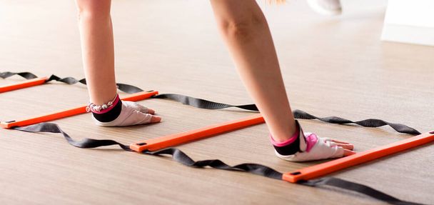 Agility ladder in use during fitness class. - Foto, immagini
