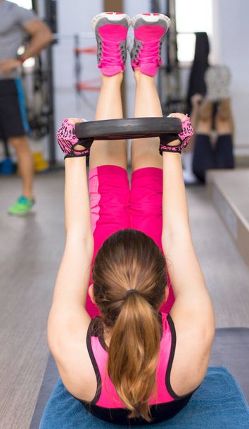 Lady using weights in group fitness class. - Photo, Image
