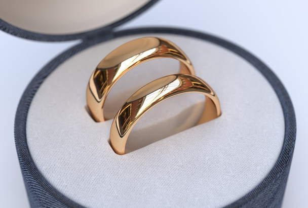 Pareja de anillos de boda de oro en joyería caja azul
 - Foto, Imagen
