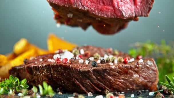 Close-up of falling tasty beef steak, slow motion. - Footage, Video