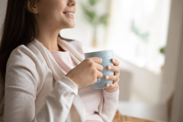 Close up of girl enjoy morning with cup of coffee - Photo, Image