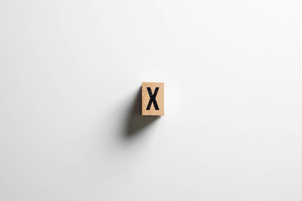 " X " text made of wooden cube on  White background with clipping path. - Foto, Imagem