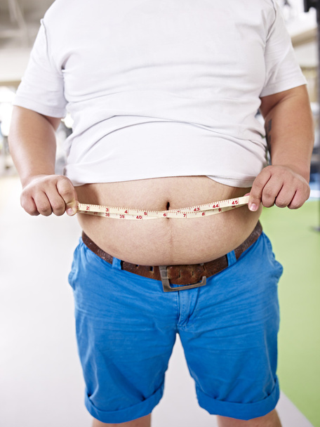 надмірна вага людини в тренажерному залі
 - Фото, зображення