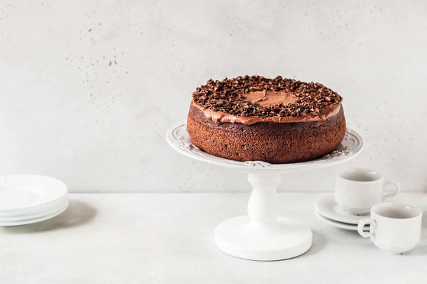 Chocolate Cake on a Cake Stand Decorated with Chocolate Shavings, copy space for your text - Foto, Bild