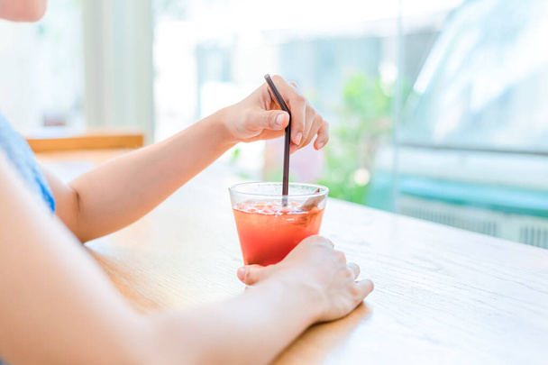 Women drink Juice strawberry mixed juice peach. Drink refreshment at sunny day. - Fotografie, Obrázek