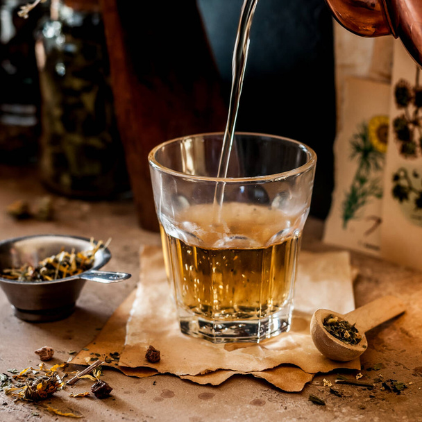 Pouring Herbal Tea into a Glass, Variety of Dried Herb Mixes, square - Foto, afbeelding