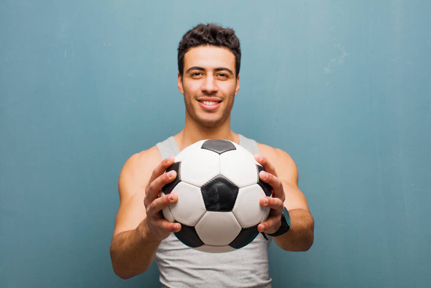 young arabian man with a soccer ball. sport concept - Zdjęcie, obraz