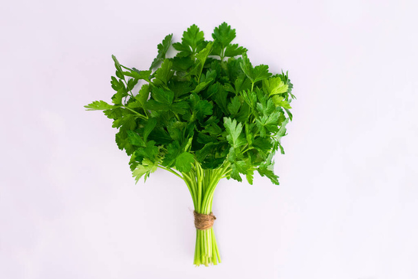 Bunch of fresh parsley isolated on a white background. Copy space. - Photo, Image