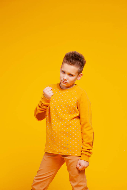 angry teen boy shows clenched fist.  - Fotografie, Obrázek