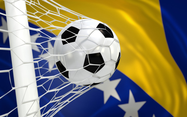 Bósnia-herzegovina, acenando a bandeira e futebol bola no gol líquido - Foto, afbeelding