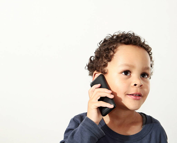 little boy with mobile making a phone call - Foto, Imagen