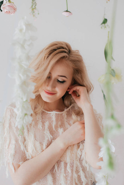 Portrait of beautiful blond woman with flowers - Foto, Imagen