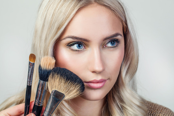portrait of beautiful woman with brush for make-up - Zdjęcie, obraz