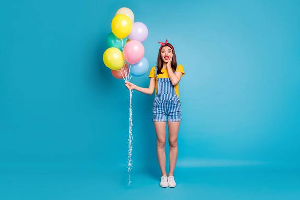 Full length body size view of her she nice attractive cheerful glad girl holding in hand colorful balls festive isolated on bright vivid shine vibrant blue green teal turquoise color background - Foto, afbeelding