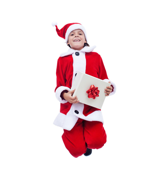 Santa claus chlapec drží krabičky a skákání s radostí - Fotografie, Obrázek