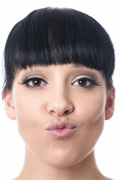 jonge vrouw met samengeknepen lippen - Foto, afbeelding