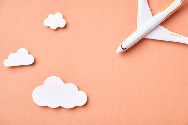 Airplane model and clouds. Fly by plane - Φωτογραφία, εικόνα