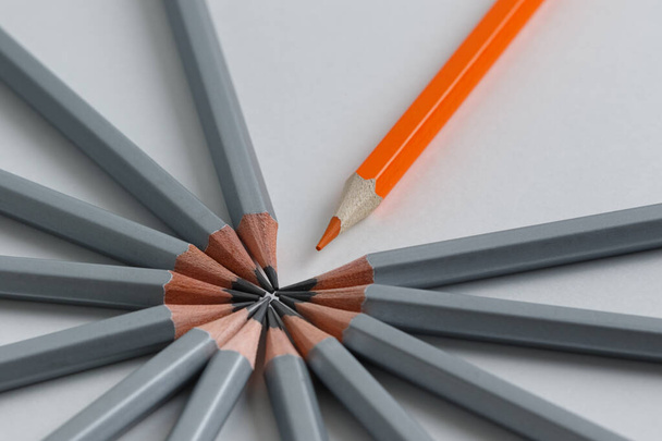 Support Group, Intervention. Conceptual. Orange and gray pencils opposite each other - Foto, immagini