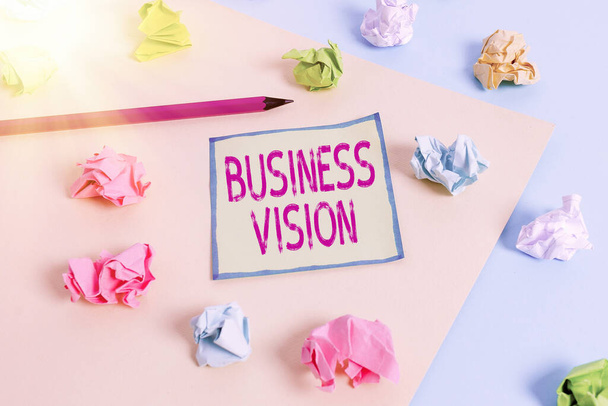 Conceptual hand writing showing Business Vision. Business photo showcasing grow your business in the future based on your goals Colored crumpled paper empty reminder blue yellow clothespin. - Photo, Image