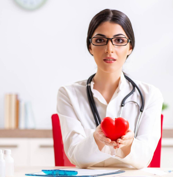 Young doctor in heart care concept - Photo, Image