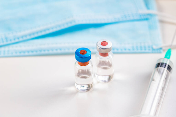 close up on vaccine and medical syringe - Zdjęcie, obraz