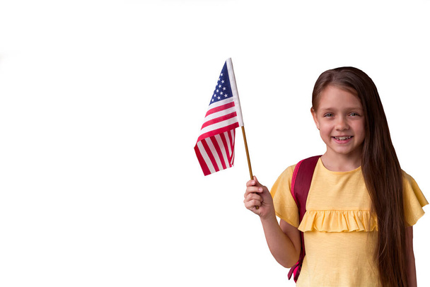 cute smiling little girl holding american flag isolated on white background,copy space - Фото, зображення